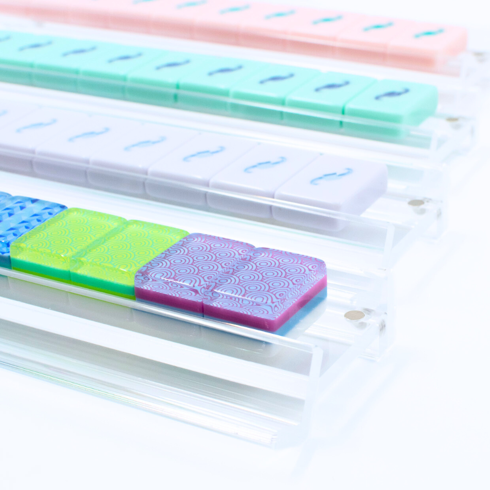 Mahjong Racks in transparent clear made of Premium Acrylic with colorful mahjongg tiles shown
