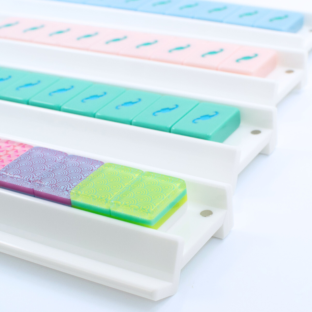 Mahjong Racks in white and made of Premium Acrylic with colorful mahjongg tiles shown