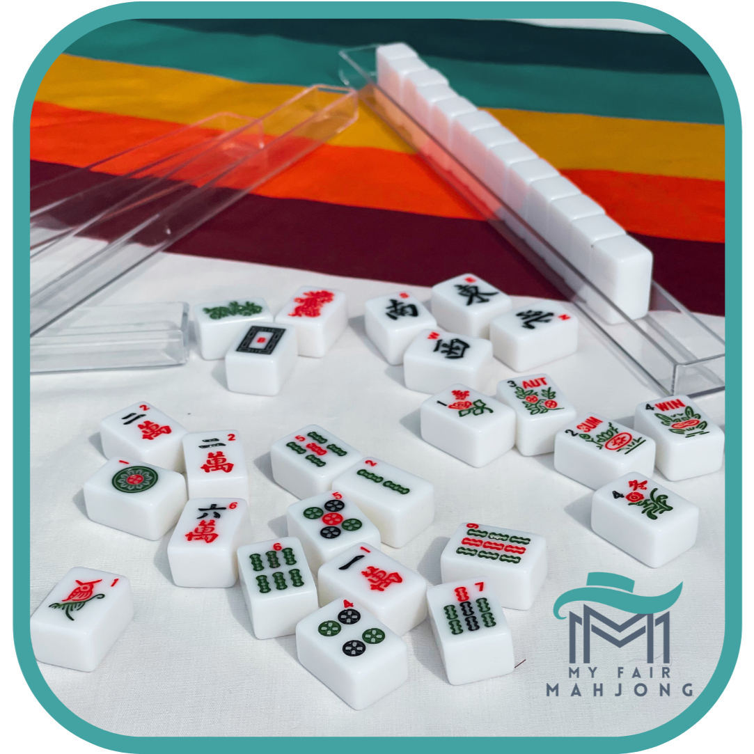 Mini American Mahjong Tile Set for Travel with Numbers and Traditional Mahjongg Symbols- White Tiles- My Fair MahjongMahjong Traditional Mini American Series Travel American Mahjongg Tile Set of 166 melamine white tiles, bright pink and teal bag, custom instruction and tips card, 2 colorful dice
