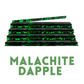 A stack of glossy black hair extensions with a bright green marbled pattern, with a single extension piece laid diagonally on top. The text 'MALACHITE DAPPLE' is written below in green capital letters on a plain white background.