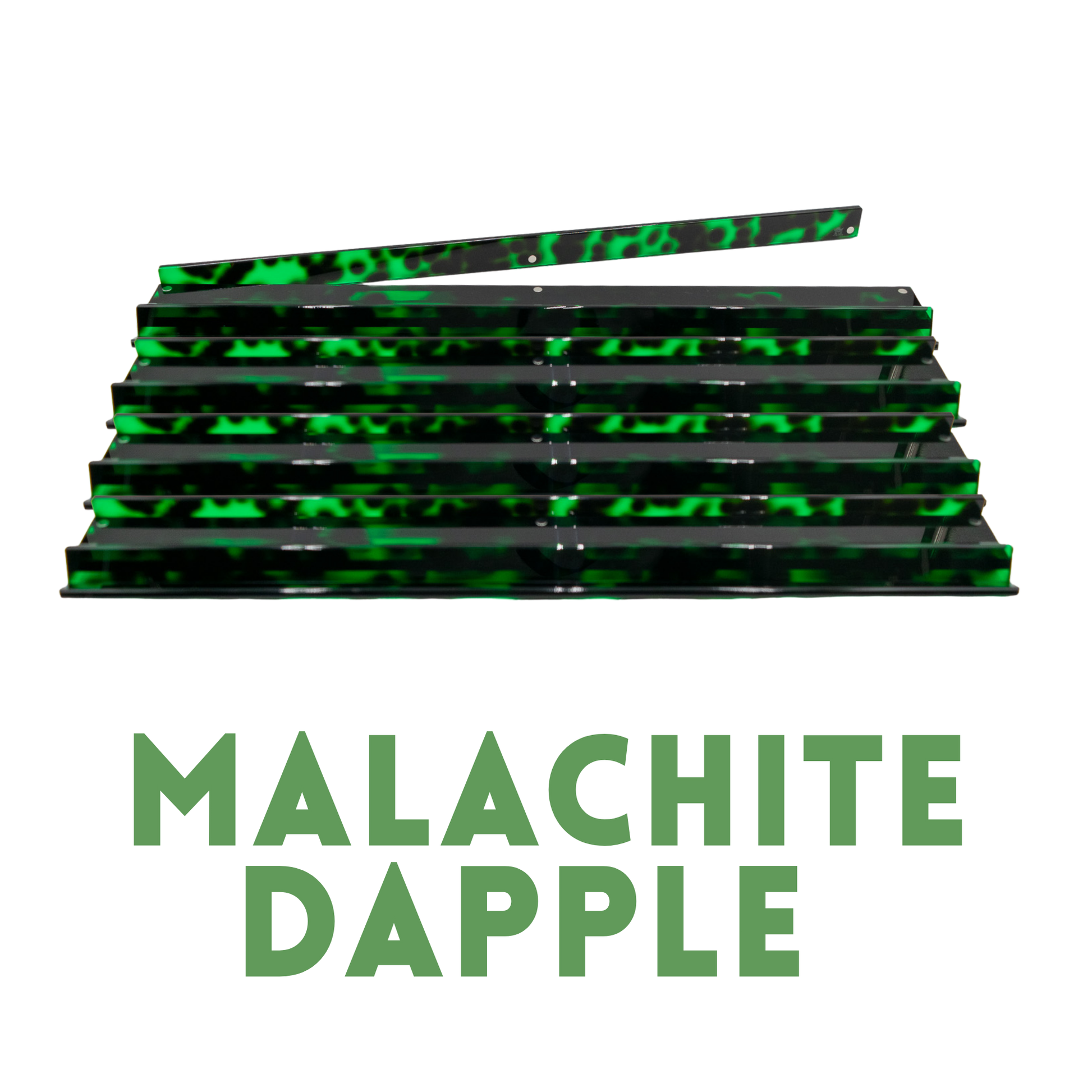 A stack of glossy black hair extensions with a bright green marbled pattern, with a single extension piece laid diagonally on top. The text 'MALACHITE DAPPLE' is written below in green capital letters on a plain white background.